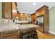 Spacious kitchen with granite countertops, stainless steel appliances, and wood cabinetry at 1133 Heritage Greens Dr, Wake Forest, NC 27587