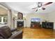 Cozy living room featuring a fireplace, hardwood floors, and natural light at 1133 Heritage Greens Dr, Wake Forest, NC 27587