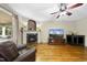 Cozy living room boasting a fireplace, hardwood floors, and comfortable seating at 1133 Heritage Greens Dr, Wake Forest, NC 27587