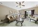 Living room with green carpet, wooden furniture, ceiling fan, and a window with nice view at 1133 Heritage Greens Dr, Wake Forest, NC 27587