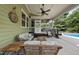 Inviting patio with wicker furniture, perfect for outdoor lounging by the pool at 1133 Heritage Greens Dr, Wake Forest, NC 27587