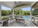 Relaxing porch offers a view of the pool, features rocking chairs, and ample seating at 1133 Heritage Greens Dr, Wake Forest, NC 27587