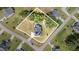 Aerial view of a property highlighting the home, surrounding landscape, and defined property lines at 119 Florentino Ct, Clayton, NC 27527