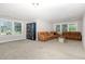 Finished basement with comfortable seating, lots of windows, and a recreational area at 119 Florentino Ct, Clayton, NC 27527
