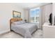 Cozy bedroom with a comfortable bed, large window with natural light, and modern decor at 119 Florentino Ct, Clayton, NC 27527