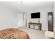 Bedroom features a television, plush carpeting and a comfortable bed at 119 Florentino Ct, Clayton, NC 27527