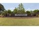 Stone sign reading 'Portofino' with manicured landscaping, marking the entrance to the community at 119 Florentino Ct, Clayton, NC 27527