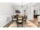 Well-lit dining room with stylish decor and a seamless transition to the kitchen at 119 Florentino Ct, Clayton, NC 27527