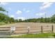 View of the community equestrian arena, perfect for horses and enjoying the community's amenities at 119 Florentino Ct, Clayton, NC 27527