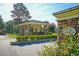 Stone guard house at the community entrance with neat landscaping, providing security and a welcoming feel at 119 Florentino Ct, Clayton, NC 27527