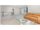 Spacious living room with plush carpeting, staircase and comfortable tan couch at 119 Florentino Ct, Clayton, NC 27527