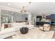 Open-concept living room showcases stylish decor, hardwood floors, and seamless flow to the kitchen at 119 Florentino Ct, Clayton, NC 27527