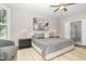 Well-lit main bedroom with calming decor, ceiling fan and an ensuite bathroom at 119 Florentino Ct, Clayton, NC 27527