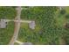 Aerial view of a home surrounded by lush trees in a quiet neighborhood at 1210 Bayview Ct, Franklinton, NC 27525
