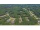This aerial view showcases a well-planned neighborhood nestled in a lush forest, offering a tranquil setting at 1210 Bayview Ct, Franklinton, NC 27525