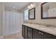 Double sink bathroom featuring granite countertops, framed mirrors, and a shower-tub combination at 1210 Bayview Ct, Franklinton, NC 27525