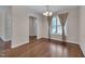 Well-lit dining room with hardwood floors and classic chandelier fixture at 1210 Bayview Ct, Franklinton, NC 27525