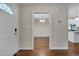 Welcoming foyer showcasing hardwood floors and views into dining and kitchen areas at 1210 Bayview Ct, Franklinton, NC 27525