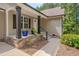 Inviting front porch with stone accents, decorative plants, and stylish columns at 1210 Bayview Ct, Franklinton, NC 27525