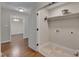 Interior shot of a laundry room; includes hookups and storage shelf at 1210 Bayview Ct, Franklinton, NC 27525