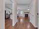 Open-concept living space with hardwood floors, fireplace, and stainless steel appliances at 1210 Bayview Ct, Franklinton, NC 27525