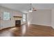 Bright living room with a fireplace, wooden mantel, and tiled surround at 1210 Bayview Ct, Franklinton, NC 27525