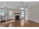 Cozy living room featuring a fireplace and wood flooring at 1210 Bayview Ct, Franklinton, NC 27525