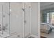 Bright bathroom featuring a glass-enclosed shower and a view into the main bedroom at 1217 Clandon Square Rd, Hillsborough, NC 27278