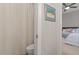 Bathroom featuring a toilet and a shower with a curtain, with a glimpse into a bedroom beyond at 1217 Clandon Square Rd, Hillsborough, NC 27278