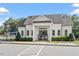 Elegant community clubhouse featuring white siding, a covered entrance, and well-maintained landscaping at 1217 Clandon Square Rd, Hillsborough, NC 27278