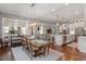 Elegant dining room with hardwood floors, stylish light fixtures, and a seamless transition to living areas at 1217 Clandon Square Rd, Hillsborough, NC 27278