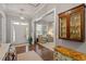 Inviting foyer with hardwood flooring, a decorative cabinet, and views into other living spaces at 1217 Clandon Square Rd, Hillsborough, NC 27278
