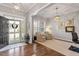 Inviting foyer with hardwood floors, a decorative chandelier, and a view into a sitting area at 1217 Clandon Square Rd, Hillsborough, NC 27278