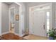 Welcoming foyer with hardwood floors, a large front door, and an open view to the adjacent room at 1217 Clandon Square Rd, Hillsborough, NC 27278