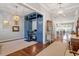 Bright home office with built-in shelving, drawers, and a workstation, complemented by hardwood floors at 1217 Clandon Square Rd, Hillsborough, NC 27278