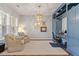 Comfortable living room with blue built-ins, neutral furniture, and natural light from large windows at 1217 Clandon Square Rd, Hillsborough, NC 27278