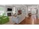 Spacious living room boasting hardwood floors, a fireplace, and an open layout with ample natural light at 1217 Clandon Square Rd, Hillsborough, NC 27278