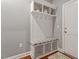 Functional mudroom area with storage bench, hooks, and cubbies providing an efficient entry point to the home at 1217 Clandon Square Rd, Hillsborough, NC 27278