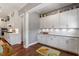 Well-organized butler's pantry with granite countertops and ample cabinet space, ideal for storage and serving at 1217 Clandon Square Rd, Hillsborough, NC 27278