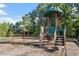 Well-equipped playground with swings and a play structure, providing a fun and safe environment for children at 1217 Clandon Square Rd, Hillsborough, NC 27278