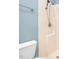 Close up of shower in renovated bathroom with updated shower head and white walls at 1230 Sykes Rd, Spring Hope, NC 27882