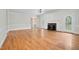 Bright living room with hardwood floors, fireplace, and french doors offering seamless indoor-outdoor living at 1230 Sykes Rd, Spring Hope, NC 27882