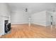 Bright living room with hardwood floors, white trim, and a cozy fireplace, ideal for gatherings at 1230 Sykes Rd, Spring Hope, NC 27882