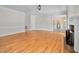 Spacious living room featuring gleaming hardwood floors, a cozy fireplace, and seamless flow to adjacent spaces at 1230 Sykes Rd, Spring Hope, NC 27882