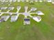 Desirable neighborhood aerial shows lush landscaping, solar panels, and well-maintained homes at 124 Lahinch Dr, Fuquay Varina, NC 27526