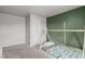 Comfortable bedroom featuring accent wall, plush carpet, and neutral paint to create a cozy atmosphere at 124 Lahinch Dr, Fuquay Varina, NC 27526