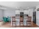 Open kitchen with stainless steel appliances, granite countertops, and a breakfast bar with seating for casual dining at 124 Lahinch Dr, Fuquay Varina, NC 27526