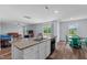 Open concept kitchen island with granite countertops provides ample space for cooking and entertaining at 124 Lahinch Dr, Fuquay Varina, NC 27526