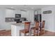 Well-equipped kitchen featuring granite countertops, stainless steel appliances, and a convenient breakfast bar with seating at 124 Lahinch Dr, Fuquay Varina, NC 27526