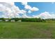 Vast land features a large grass area and mature trees, offering endless possibilities at 124 Lahinch Dr, Fuquay Varina, NC 27526